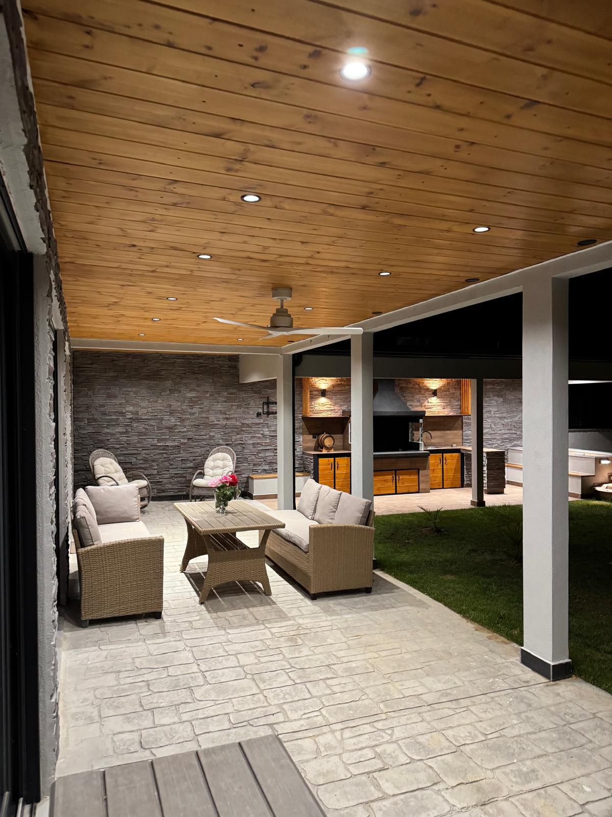 Andrijana Luxury Houses estate overview with lush gardens and mountain backdrop